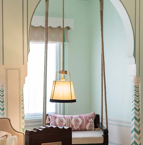 Suite detail — arch doorway with brass lamp