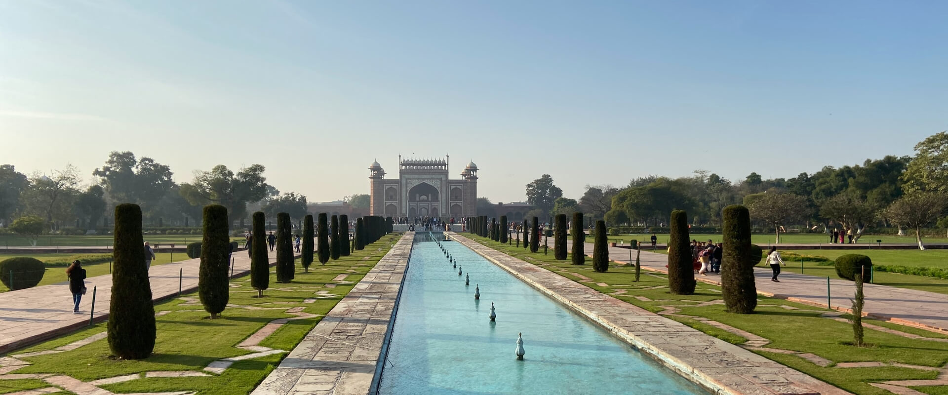 Mughal garden with long water channel and gate — Jaipur heritage landmark