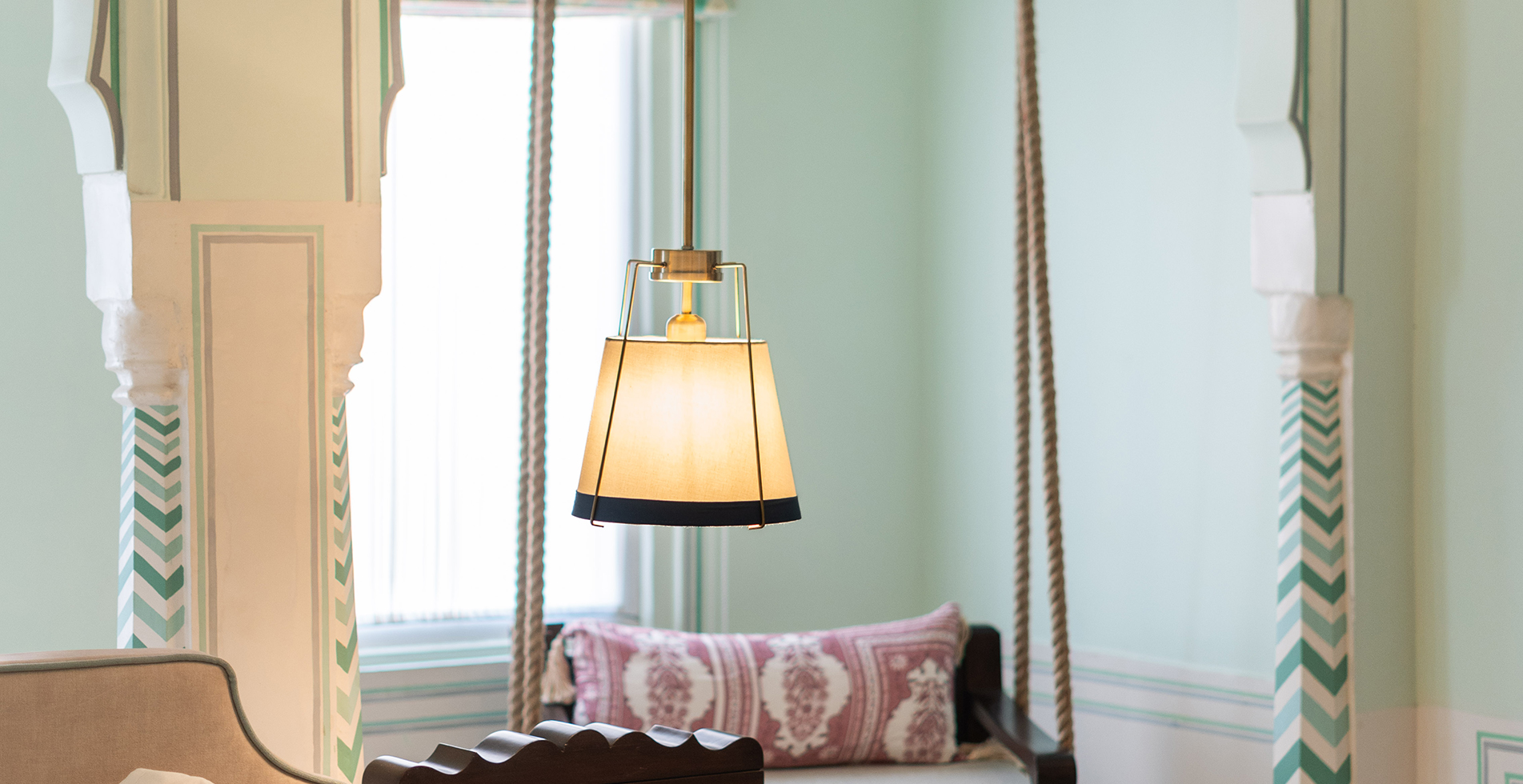 Mint-green suite with brass pendant and rope swing at Padmaa Jaipur
