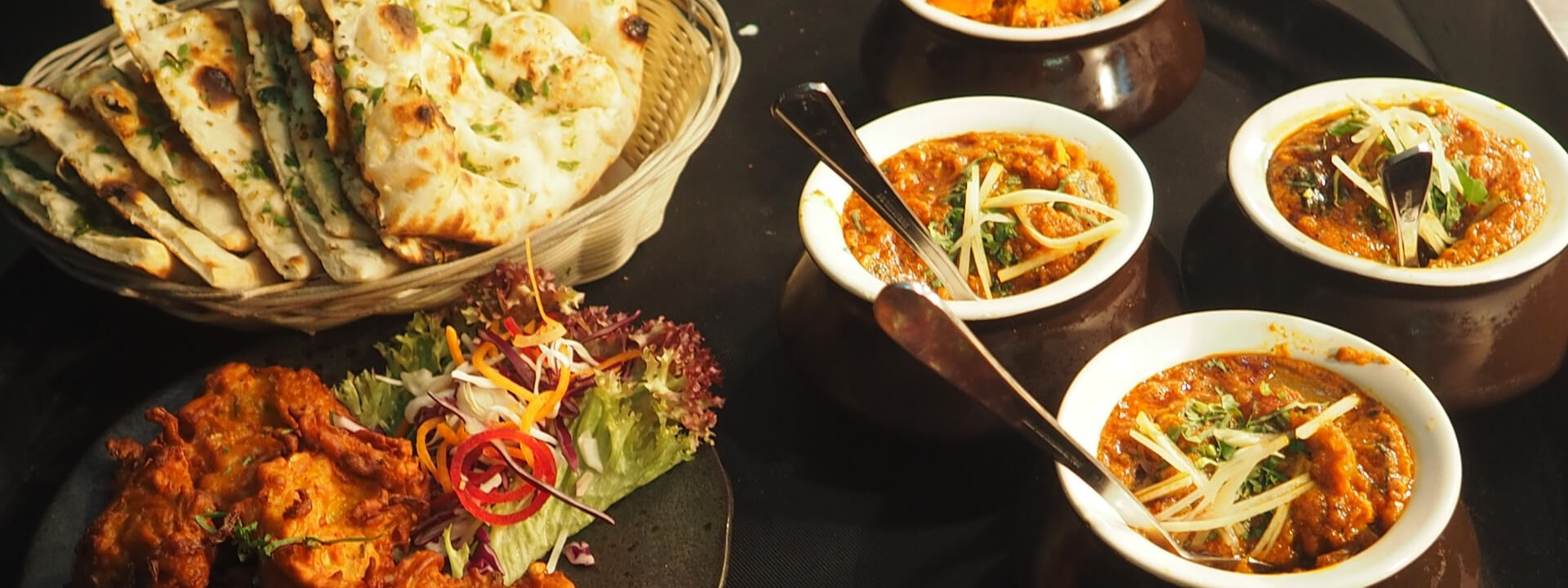 Rajasthani cuisine at Padmaa — naan basket, curries, pakoras, salad