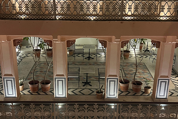 Chandni — moonlit mini courtyard with arches, plants, and wrought-iron railings at Padmaa